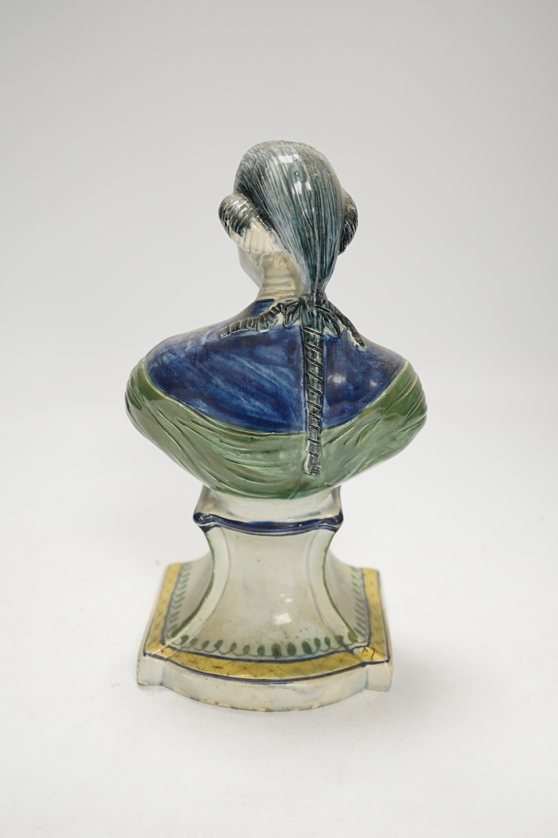 A Staffordshire pearlware portrait bust of a gentleman, possibly William Pitt the Younger, c.1790, painted in Pratt type colours, 23cm high